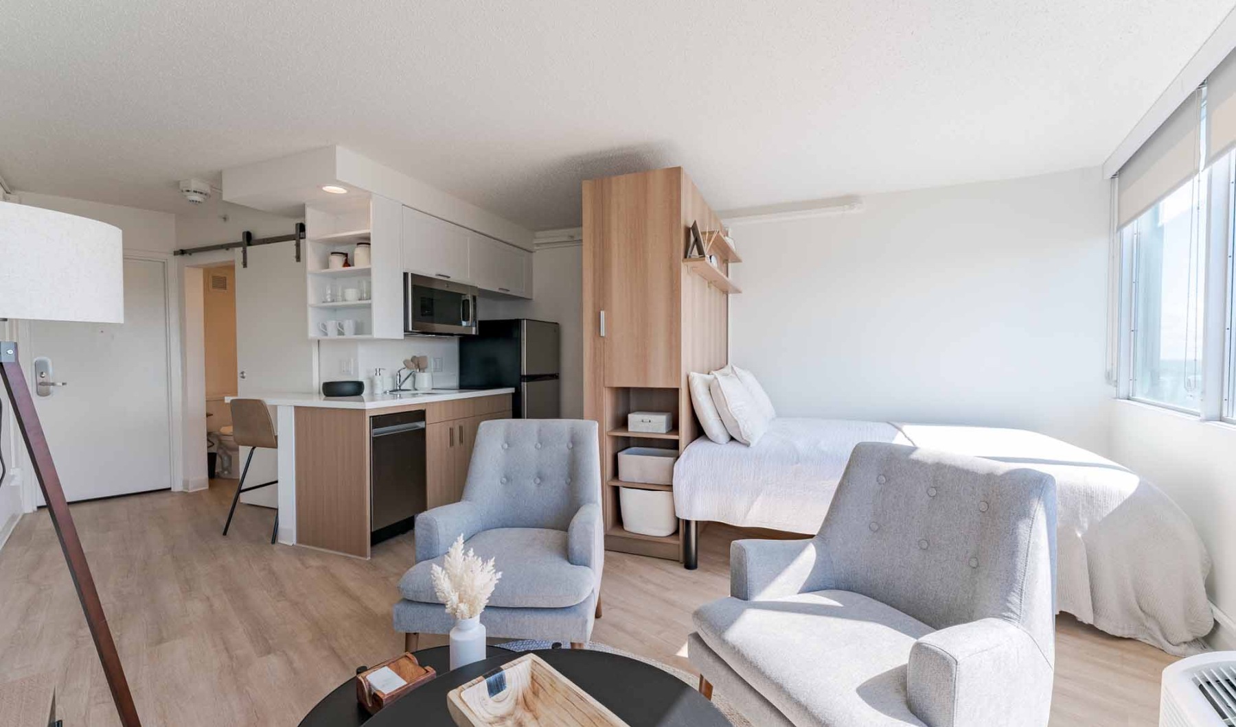 apartment with grey chairs and natural sunlight apartment with grey chairs and natural sunlight